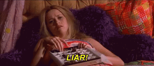 A still frame of Elle Woods from the film Legally Blonde eating chocolate in bed with the caption, "Liar!"
