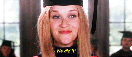 A GIF of Elle Woods from the film Legally Blonde wearing a graduation cap and gown gleefully saying, "We did it!"