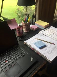 Photo of a desk neatly organized with a laptop and various office supplies.